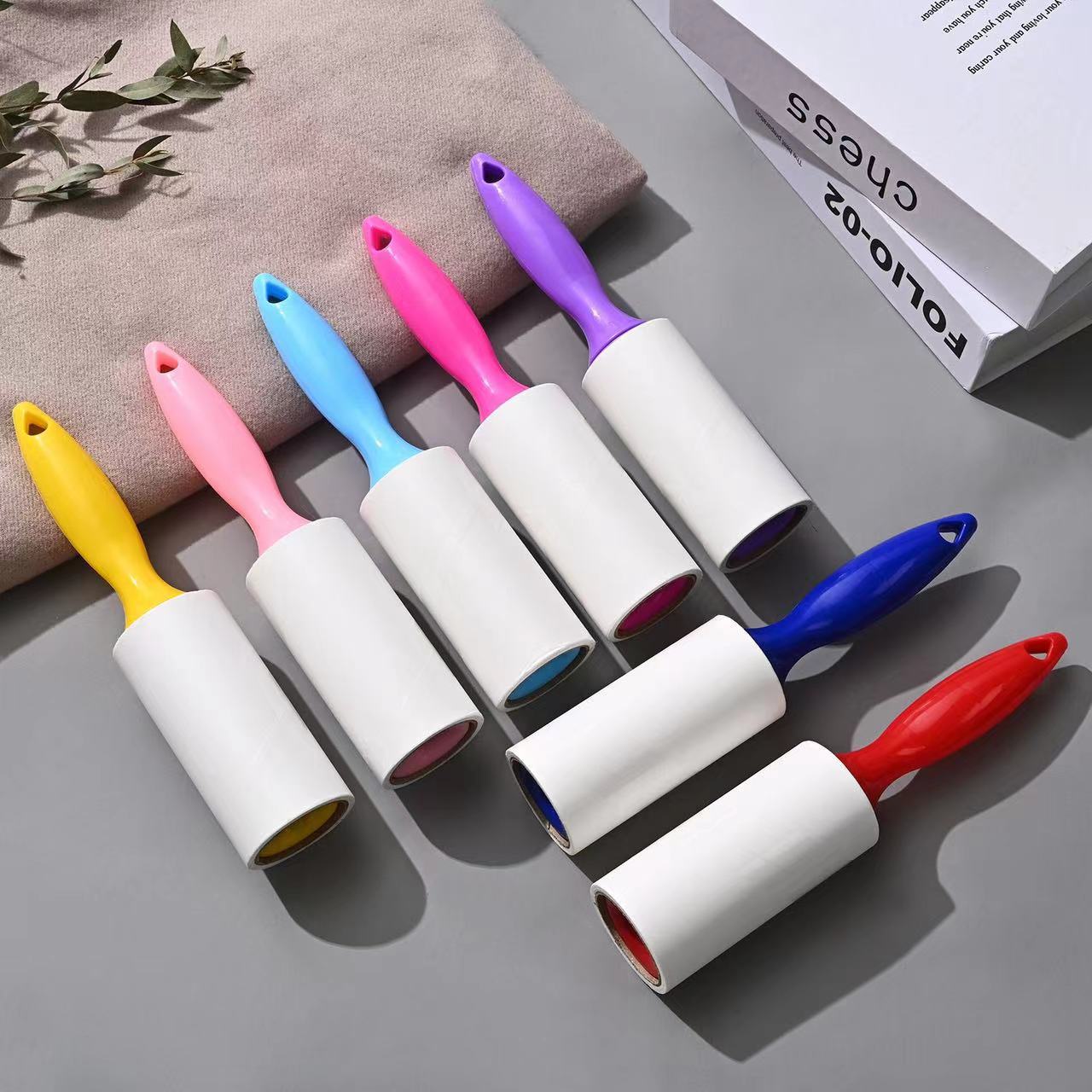Tearable Lint Remover roller in various colors designed for removing lint, pet hair, and dust from surfaces.